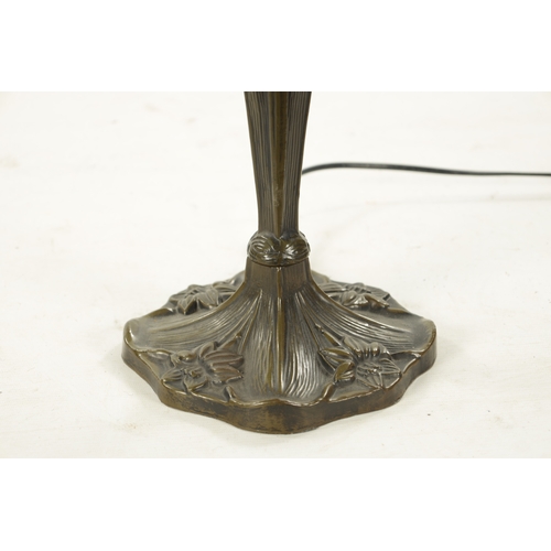 924 - A 20TH CENTURY TIFFANY STYLE BRONZE LAMP with stained glass shade and art nouveau style patinated ba... 