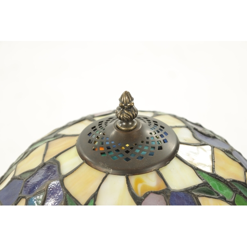 924 - A 20TH CENTURY TIFFANY STYLE BRONZE LAMP with stained glass shade and art nouveau style patinated ba... 