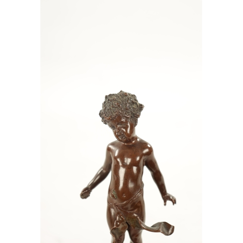 931 - A SMALL 19TH CENTURY BROWN PATINATED BRONZE OF A BOY depicted with a beetle on his belly, mounted on... 