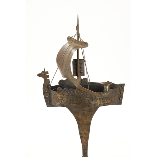 934 - AN ARTS AND CRAFTS NOVELTY STEELWORK STANDING ASHTRAY formed as a galleon (90cm high )