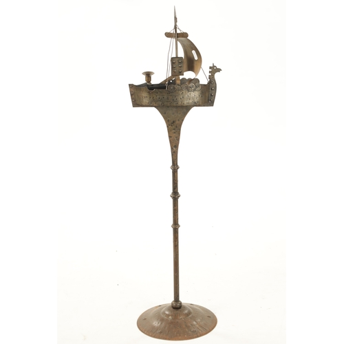 934 - AN ARTS AND CRAFTS NOVELTY STEELWORK STANDING ASHTRAY formed as a galleon (90cm high )