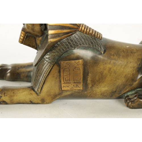 936 - A 19TH CENTURY FRENCH EGYPTIAN REVIVAL BRONZE FIGURE OF A SEATED SPHINX bearing engraved hieroglyphi... 