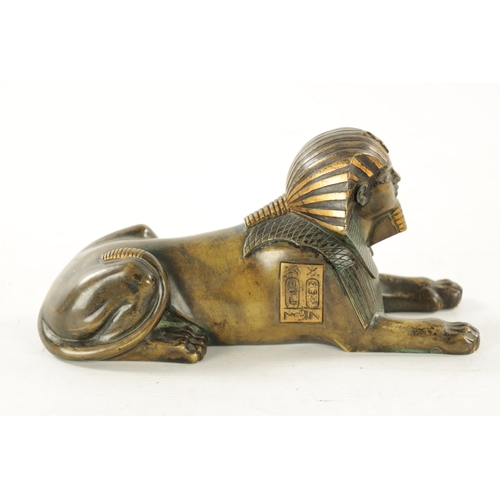 936 - A 19TH CENTURY FRENCH EGYPTIAN REVIVAL BRONZE FIGURE OF A SEATED SPHINX bearing engraved hieroglyphi... 