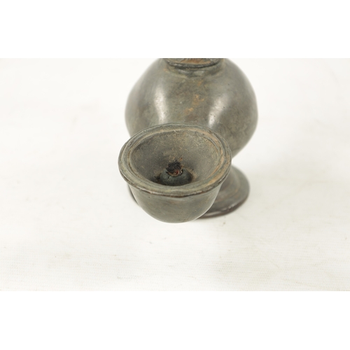 939 - AN 18TH CENTURY PEWTER WHALING LAMP with mask head lid and pierced back. (28cm wide )