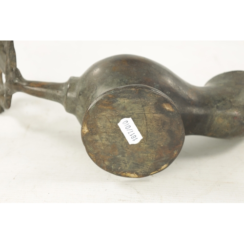 939 - AN 18TH CENTURY PEWTER WHALING LAMP with mask head lid and pierced back. (28cm wide )