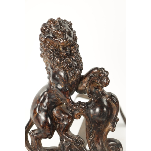 940 - A PAIR OF 19TH CENTURY BRONZE SCULPTURED CHENETS modelled as heraldic lions on shaped bases (38cm hi... 