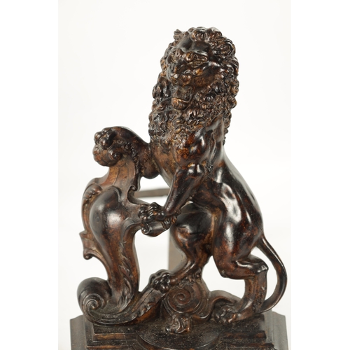 940 - A PAIR OF 19TH CENTURY BRONZE SCULPTURED CHENETS modelled as heraldic lions on shaped bases (38cm hi... 