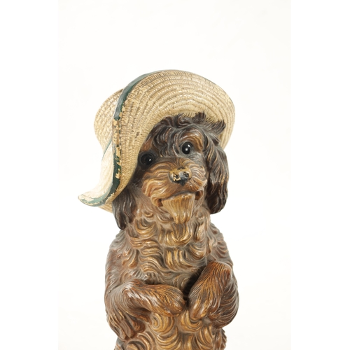 948 - A PAIR OF LATE 19TH CENTURY AUSTRIAN COLD-PAINTED TERRACOTTA MODELS OF DOGS seated with hats and one... 