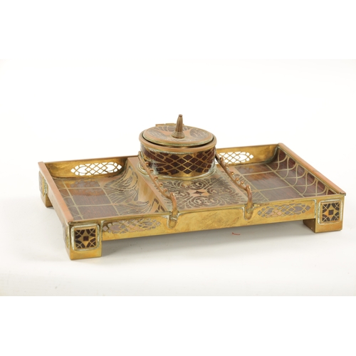 950 - ERHARD & SOHNE, A ROSEWOOD AND BRASS INLAID INK STAND of rectangular form, central circular inkwell ... 