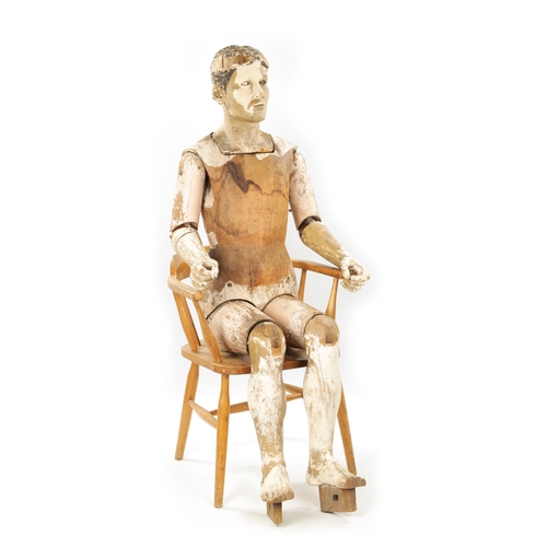 951 - A LATE 19TH CENTURY LIFE-SIZE CARVED HARDWOOD LAY FIGURE with gesso finish and articulated limbs. (1... 