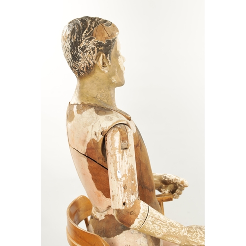 951 - A LATE 19TH CENTURY LIFE-SIZE CARVED HARDWOOD LAY FIGURE with gesso finish and articulated limbs. (1... 