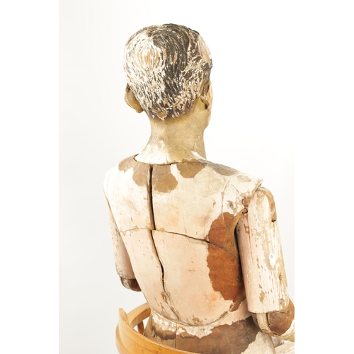 951 - A LATE 19TH CENTURY LIFE-SIZE CARVED HARDWOOD LAY FIGURE with gesso finish and articulated limbs. (1... 