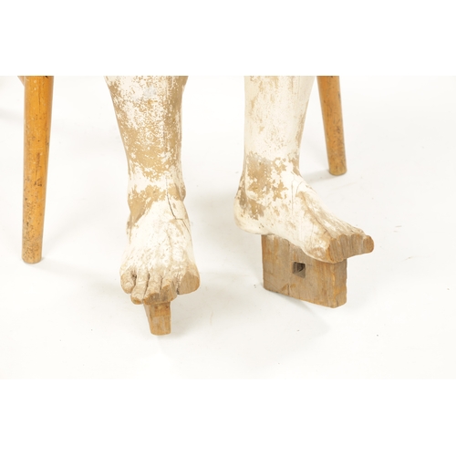 951 - A LATE 19TH CENTURY LIFE-SIZE CARVED HARDWOOD LAY FIGURE with gesso finish and articulated limbs. (1... 