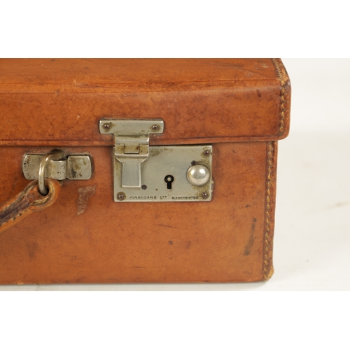 957 - A VINTAGE LEATHER CASE STAMPED FINNIGANS MANCHESTER - with keys (35cm wide 25cm deep 10cm high)