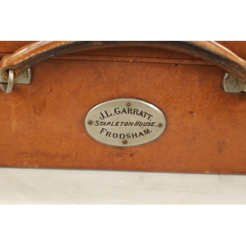 957 - A VINTAGE LEATHER CASE STAMPED FINNIGANS MANCHESTER - with keys (35cm wide 25cm deep 10cm high)