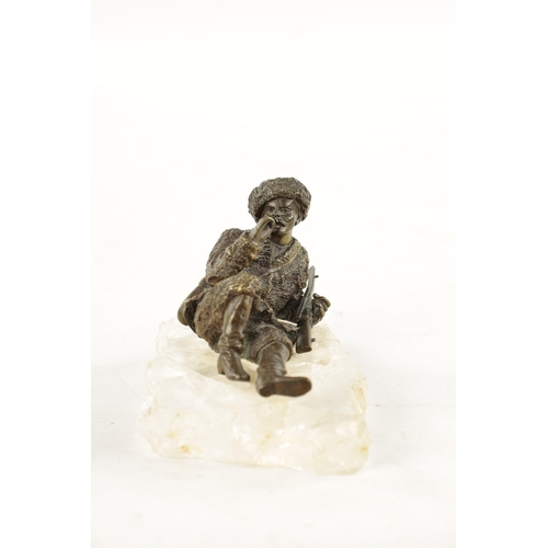 970 - A LATE 19TH CENTURY RUSSIAN BRONZE SCULPTURE ON A ROCK CRYSTAL BASE of a cossack smoking a pipe. (17... 