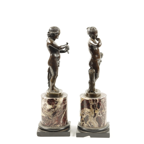 972 - A PAIR OF 19TH CENTURY FIGURAL BRONZES depicting young girls mounted on veined marble socle bases (3... 