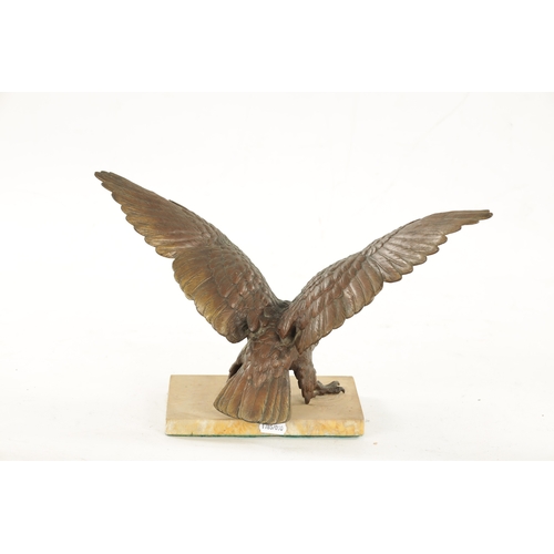 977 - A 19TH CENTURY COLD PAINTED BRONZE SCULPTURE modelled as an eagle with spread-out wings on a marble ... 