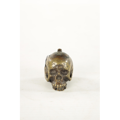 978 - A RARE POSSIBLY 17TH CENTURY DUTCH BRASS POMANDER formed as a skull with pierced hinged lid. (7cm ov... 