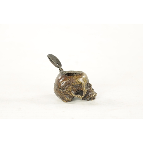 978 - A RARE POSSIBLY 17TH CENTURY DUTCH BRASS POMANDER formed as a skull with pierced hinged lid. (7cm ov... 