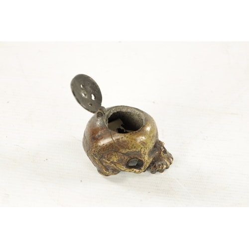 978 - A RARE POSSIBLY 17TH CENTURY DUTCH BRASS POMANDER formed as a skull with pierced hinged lid. (7cm ov... 