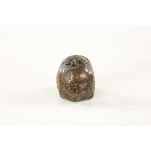 978 - A RARE POSSIBLY 17TH CENTURY DUTCH BRASS POMANDER formed as a skull with pierced hinged lid. (7cm ov... 