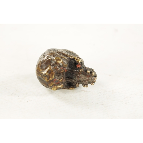 978 - A RARE POSSIBLY 17TH CENTURY DUTCH BRASS POMANDER formed as a skull with pierced hinged lid. (7cm ov... 