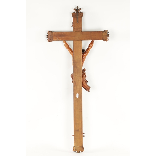 979 - A GOOD 19TH CENTURY CARVED WALNUT CORPUS CRISTI of large size with box wood inlaid cross. (90cm over... 