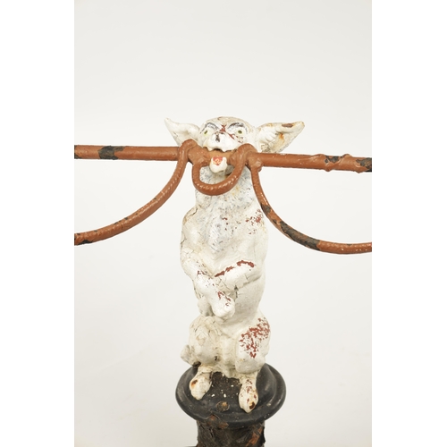 985 - A 19TH CENTURY CAST IRON NOVELTY STICKSTAND modelled as a Jack Russell dog standing on hind legs hol... 