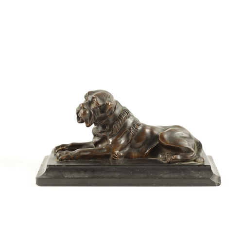 990 - A 19TH CENTURY PATINATED BRONZE SCULPTURE modelled as a recumbent bull mastif dog mounted on a mould... 