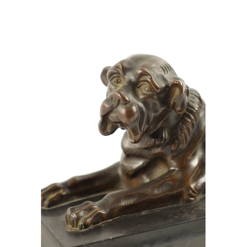 990 - A 19TH CENTURY PATINATED BRONZE SCULPTURE modelled as a recumbent bull mastif dog mounted on a mould... 