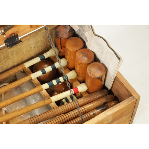 991 - AN EDWARDIAN CROQUET SET complete with eight mallets in pine box (96cm wide )