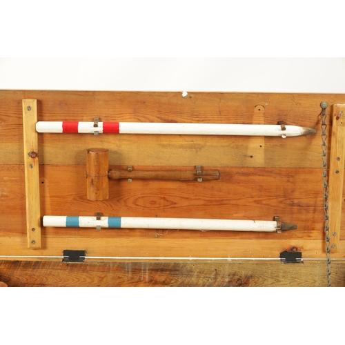 991 - AN EDWARDIAN CROQUET SET complete with eight mallets in pine box (96cm wide )