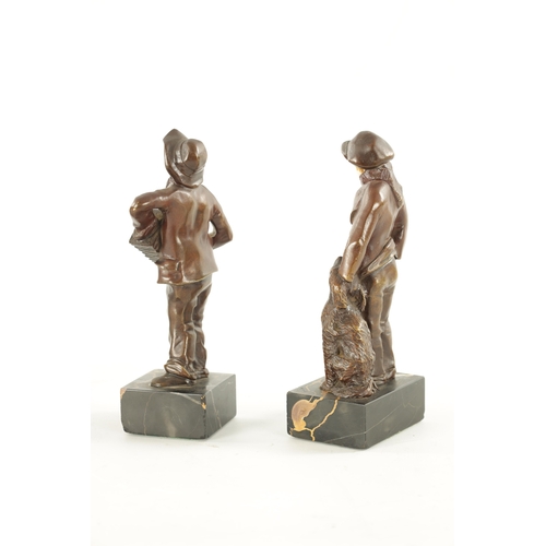 997 - A PAIR OF ARTS AND CRAFTS BRONZE AND IVORY FIGURES depicting a boy and his dog and a boy playing a s... 