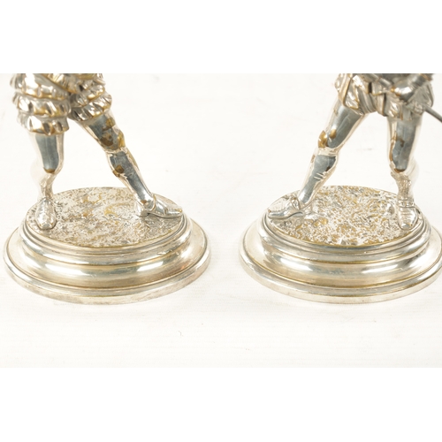 998 - EMILE GUILLEMIN. A PAIR OF SILVERED BRONZE SCULPTURES DEPICTING CAVALIERS on oval moulded bases - si... 