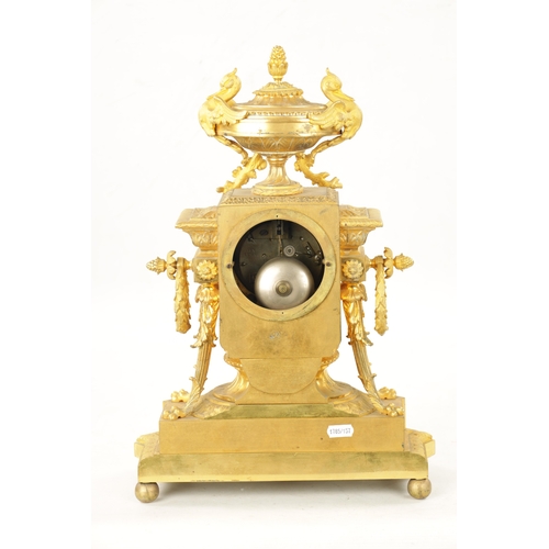 1199 - A 19TH CENTURY FRENCH ORMOLU MANTEL CLOCK with an enamel dial and Roman numerals, fronting a spring-... 