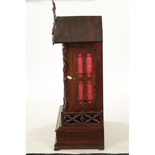 1201 - A LARGE LATE 19TH CENTURY BLACK FOREST TRUMPETER CLOCK the leaf-carved architectural walnut case wit... 