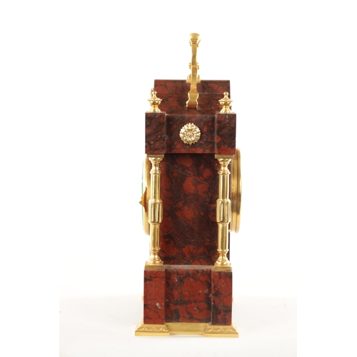 1202 - A LATE 19TH CENTURY FRENCH ORMOLU MOUNTED ROUGE MARBLE MANTEL CLOCK the shaped case with ormolu colu... 