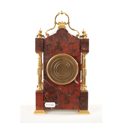 1202 - A LATE 19TH CENTURY FRENCH ORMOLU MOUNTED ROUGE MARBLE MANTEL CLOCK the shaped case with ormolu colu... 