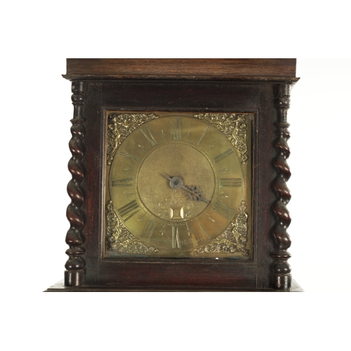 1235 - GABRIEL SMITH, BARTHOMLEY. AN EARLY 18TH CENTURY OAK 30-HOUR LONGCASE CLOCK the hood with architectu... 