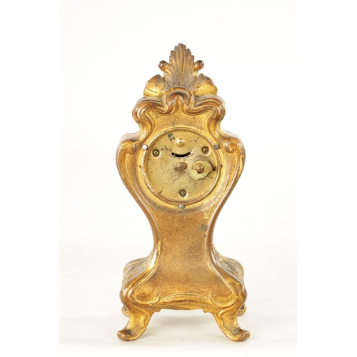 1253 - A GILT BRONZE ART NOUVEAU MANTEL CLOCK the floral shaped case enclosing an enamel Roman dial frontin... 