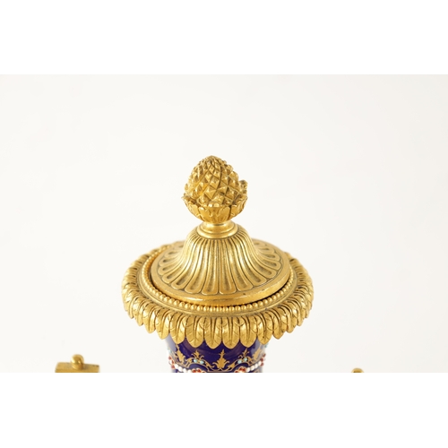 1299 - A FINE 19TH CENTURY FRENCH ORMOLU AND SEVRES PORCELAIN CLOCK GARNITURE the case surmounted by a larg... 