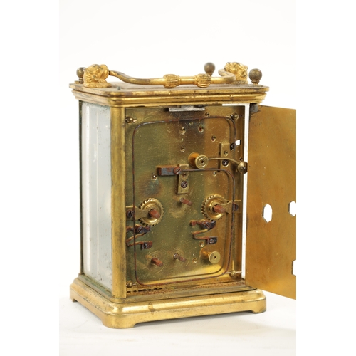 1307 - A MID 19TH CENTURY STRIKING CARRIAGE CLOCK WITH CALENDAR the gilt brass case with lion head handle m... 