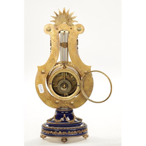 1318 - A LATE 19TH CENTURY FRENCH PORCELAIN AND ORMOLU MOUNTED LYRE-SHAPED MANTEL CLOCK the jewelled swingi... 