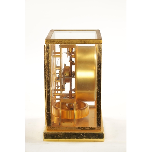 1319 - A 1950's LE-COULTRE ATMOS CLOCK with a gilt brass framed case and hinged front door enclosing a skel... 