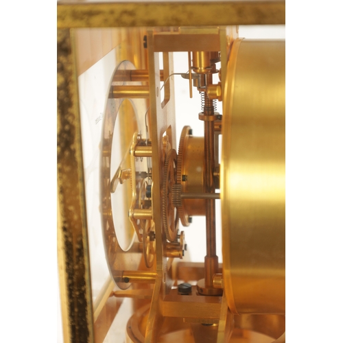 1319 - A 1950's LE-COULTRE ATMOS CLOCK with a gilt brass framed case and hinged front door enclosing a skel... 