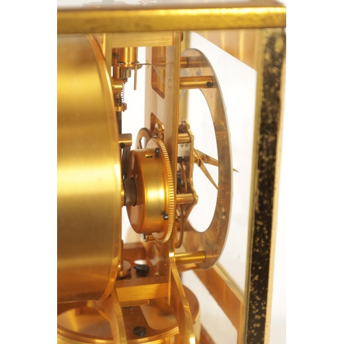 1319 - A 1950's LE-COULTRE ATMOS CLOCK with a gilt brass framed case and hinged front door enclosing a skel... 