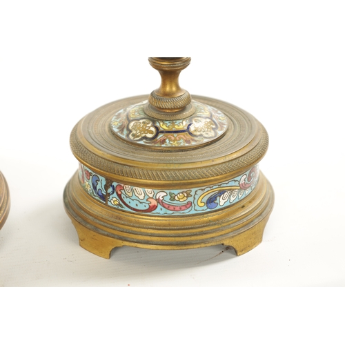 1321 - A LATE 19TH CENTURY FRENCH ORMOLU AND CHAMPLEVE ENAMEL CLOCK GARNITURE the unusual circular four-gla... 