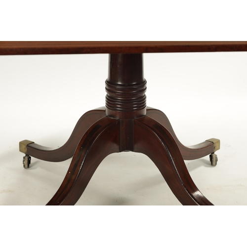 1497 - A GOOD REGENCY MAHOGANY AND EBONY INLAID PEDESTAL DINING TABLE OF LARGE SIZE with inlaid edge top ab... 