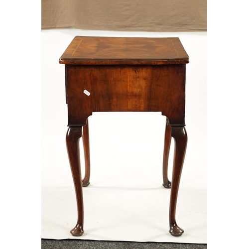 1499 - A QUEEN ANNE FIGURED WALNUT LOWBOY with quarter veneered top above four drawers with round brass han... 